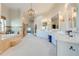Large bathroom with double vanity, soaking tub, and walk-in shower at 2780 Vickie Ct, Kissimmee, FL 34744