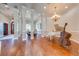 Grand living room with hardwood floors, piano, and cello display at 2780 Vickie Ct, Kissimmee, FL 34744