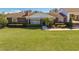 Brick ranch house with a large front yard and walkway at 2780 Vickie Ct, Kissimmee, FL 34744