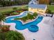 Luxury pool and spa with surrounding landscaping at 2780 Vickie Ct, Kissimmee, FL 34744