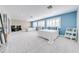Bright bedroom with two beds, ample space, and blue accent wall at 2780 Vickie Ct, Kissimmee, FL 34744