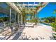 Relaxing patio with pergola, seating, and pool views at 2780 Vickie Ct, Kissimmee, FL 34744