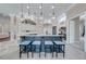 Modern kitchen with an island, breakfast bar, and stylish light fixtures at 2780 Vickie Ct, Kissimmee, FL 34744