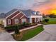 Brick house with landscaping and a circular driveway at 2780 Vickie Ct, Kissimmee, FL 34744