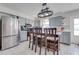 Kitchen with gray cabinets, island, and stainless steel appliances at 2780 Vickie Ct, Kissimmee, FL 34744