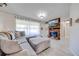 Living room with sectional sofa, fireplace, and hardwood floors at 2780 Vickie Ct, Kissimmee, FL 34744