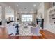 Bright living room with comfy seating, fireplace, and large window at 2780 Vickie Ct, Kissimmee, FL 34744