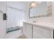 Bathroom with white vanity, bathtub, and shower at 2780 Vickie Ct, Kissimmee, FL 34744