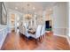 Spacious dining room with hardwood floors, large table, and chandelier at 2780 Vickie Ct, Kissimmee, FL 34744