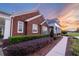 Brick house with landscaping and walkway at sunset at 2780 Vickie Ct, Kissimmee, FL 34744