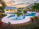 Large freeform pool and spa with outdoor kitchen at 2780 Vickie Ct, Kissimmee, FL 34744