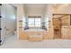 Spa-like bathroom with a large soaking tub and walk-in shower at 2780 Vickie Ct, Kissimmee, FL 34744