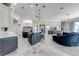 Open concept kitchen and living area with modern fixtures and a large island at 2780 Vickie Ct, Kissimmee, FL 34744
