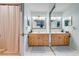 Bathroom with double vanity and mirrored sliding doors at 2780 Vickie Ct, Kissimmee, FL 34744
