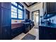Functional laundry room with copper sink, washer, dryer, and ample storage at 2780 Vickie Ct, Kissimmee, FL 34744