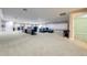 Open concept basement with a conference table, sectional sofa and additional rooms at 2780 Vickie Ct, Kissimmee, FL 34744
