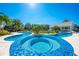 Luxury hot tub with blue mosaic tiles and pool views at 2780 Vickie Ct, Kissimmee, FL 34744