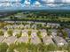 Aerial view of community and home's location near golf course at 7127 Harmony Square S Dr # 7127, Harmony, FL 34773