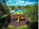 Community pool and playground visible from above at 2280 San Vital Dr # 105, Kissimmee, FL 34741