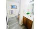 Clean bathroom with wood-look flooring, a toilet, and a vanity at 2280 San Vital Dr # 105, Kissimmee, FL 34741
