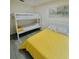 Bedroom with a full-size bed and a bunk bed, featuring wood-look floors at 2280 San Vital Dr # 105, Kissimmee, FL 34741