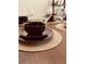 Elegant dining area with a round table and four chairs at 2280 San Vital Dr # 105, Kissimmee, FL 34741