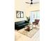 Bright living room with leather sofa and wood coffee table at 2280 San Vital Dr # 105, Kissimmee, FL 34741