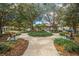 Circular community park with benches and landscaping surrounding the entrance at 7127 Harmony Square S Dr # 7127, Harmony, FL 34773