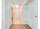 Bright hallway with access to bathroom and storage at 7127 Harmony Square S Dr # 7127, Harmony, FL 34773