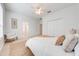 Bright bedroom with ceiling fan and cozy sitting area at 7127 Harmony Square S Dr # 7127, Harmony, FL 34773