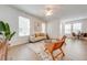 Spacious living room with hardwood floors and plenty of natural light at 7127 Harmony Square S Dr # 7127, Harmony, FL 34773