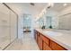 Double vanity bathroom with shower and view of bedroom at 7127 Harmony Square S Dr # 7127, Harmony, FL 34773