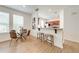 Open dining area with breakfast bar and kitchen views at 7127 Harmony Square S Dr # 7127, Harmony, FL 34773