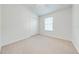 Simple bedroom with neutral walls and carpet flooring at 7127 Harmony Square S Dr # 7127, Harmony, FL 34773