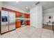 Well-equipped kitchen with stainless steel appliances and wood cabinetry at 7127 Harmony Square S Dr # 7127, Harmony, FL 34773