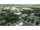 Community clubhouse, pool, and tennis courts are nestled in a lush landscape at 7127 Harmony Square S Dr # 7127, Harmony, FL 34773