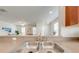 Double kitchen sink with a view into the living room at 7127 Harmony Square S Dr # 7127, Harmony, FL 34773