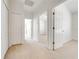 Bright hallway with carpeted floors and access to bedrooms at 7127 Harmony Square S Dr # 7127, Harmony, FL 34773