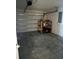 Attached garage with overhead door and storage shelving at 2796 Whispering Trails Dr, Winter Haven, FL 33884