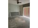 Empty living room with ceiling fan and sliding glass door at 2796 Whispering Trails Dr, Winter Haven, FL 33884