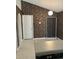 Kitchen with patterned wallpaper and white door at 2796 Whispering Trails Dr, Winter Haven, FL 33884