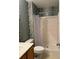 Bathroom with shower, toilet, and patterned wallpaper at 2796 Whispering Trails Dr, Winter Haven, FL 33884