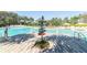 Resort-style pool with a wooden deck and signage at 742 Longboat Dr, Davenport, FL 33896