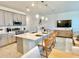 Modern kitchen with stainless steel appliances and grey cabinets at 742 Longboat Dr, Davenport, FL 33896
