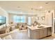 Open kitchen with white countertops, grey cabinets, and an island at 742 Longboat Dr, Davenport, FL 33896