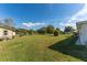 Large backyard with grassy area and shed at 1395 Emerald Dr, Kissimmee, FL 34744