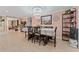 Dining room with a large table, chandelier, and access to the kitchen at 1395 Emerald Dr, Kissimmee, FL 34744