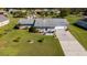 Single-story house with a large backyard and a long driveway at 1395 Emerald Dr, Kissimmee, FL 34744