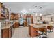 Kitchen boasts granite countertops, stainless steel appliances, and an island at 1395 Emerald Dr, Kissimmee, FL 34744