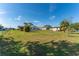 Spacious backyard with grassy lawn and home at 1395 Emerald Dr, Kissimmee, FL 34744